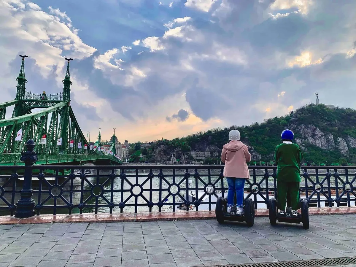 Riders on Segways by Liberty Bridge, Budapest